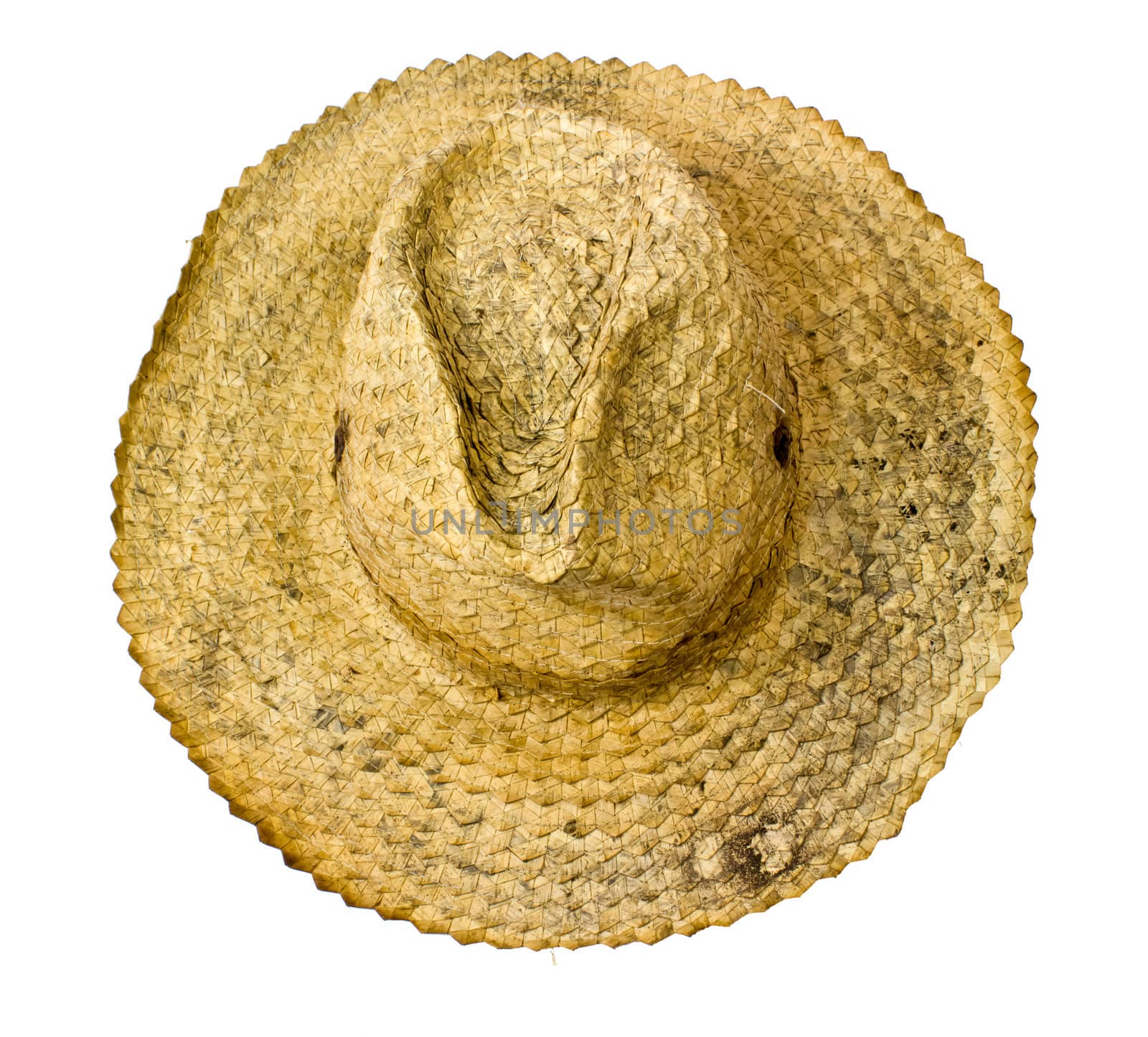 Top view of a old round straw hat on a white background.