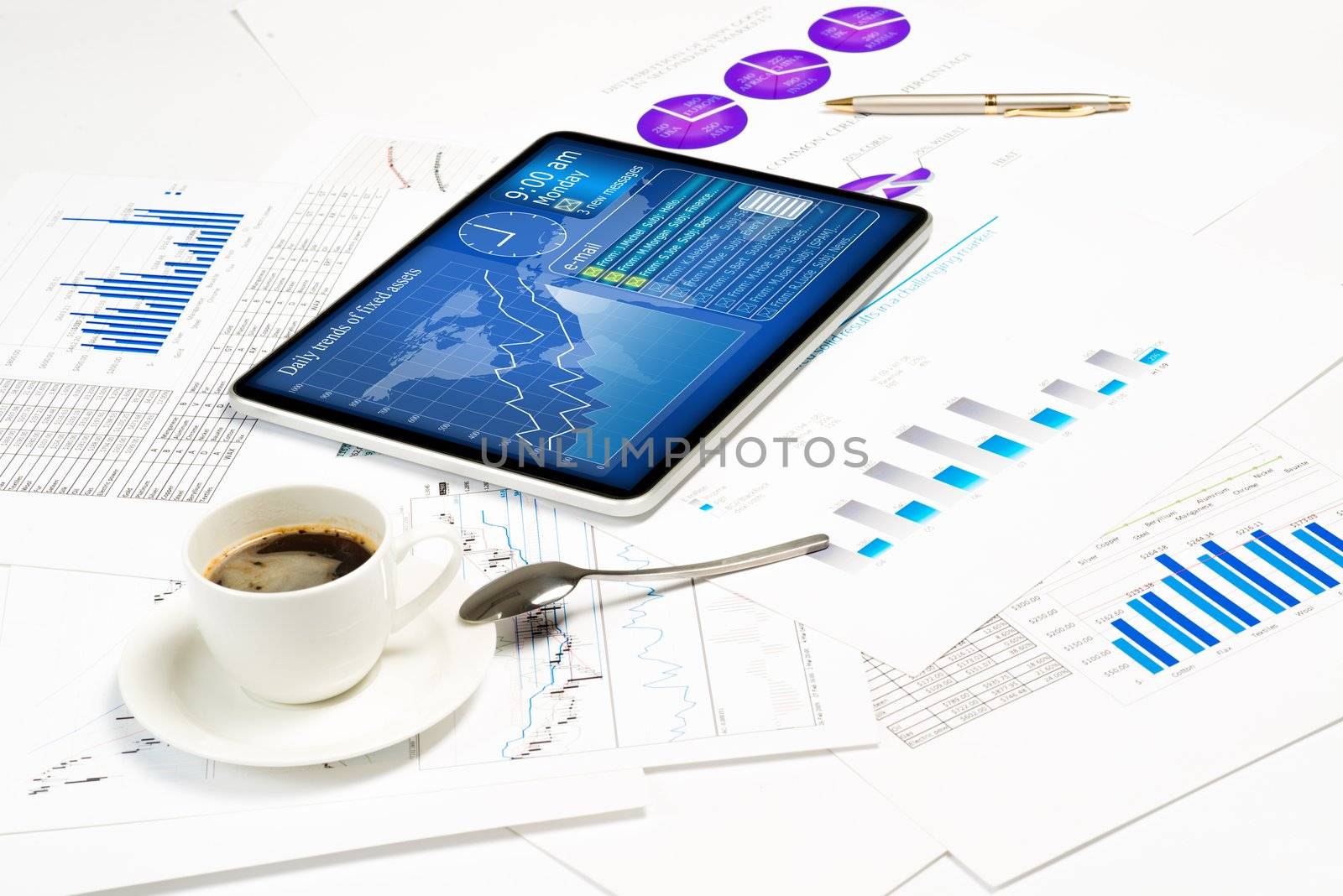 tablet, financial documents and a cup of coffee by adam121