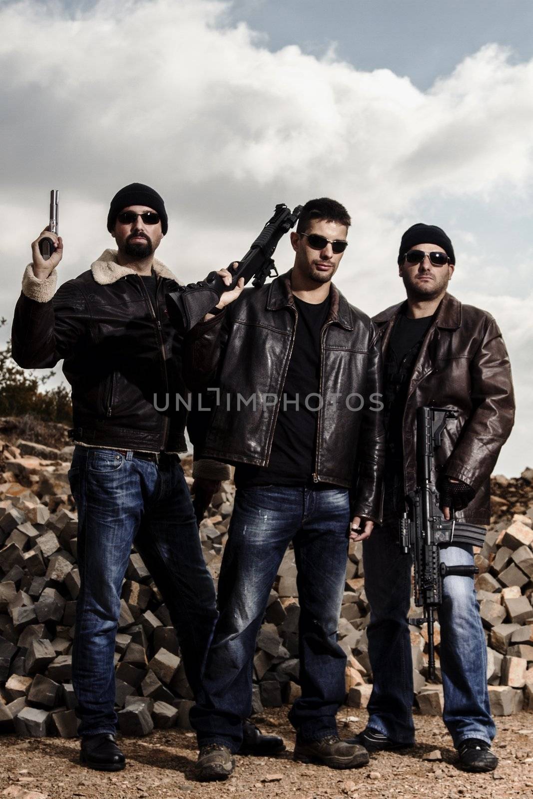 View of a group of gang members with guns.