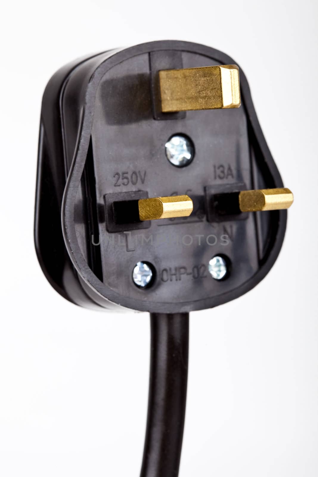 Close-up shot of a UK plug over a white background.