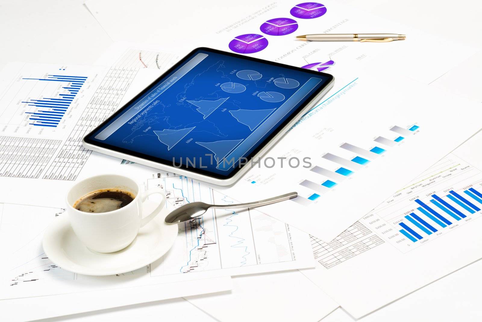 tablet, financial documents and a cup of coffee, still life showing modern technologies in business