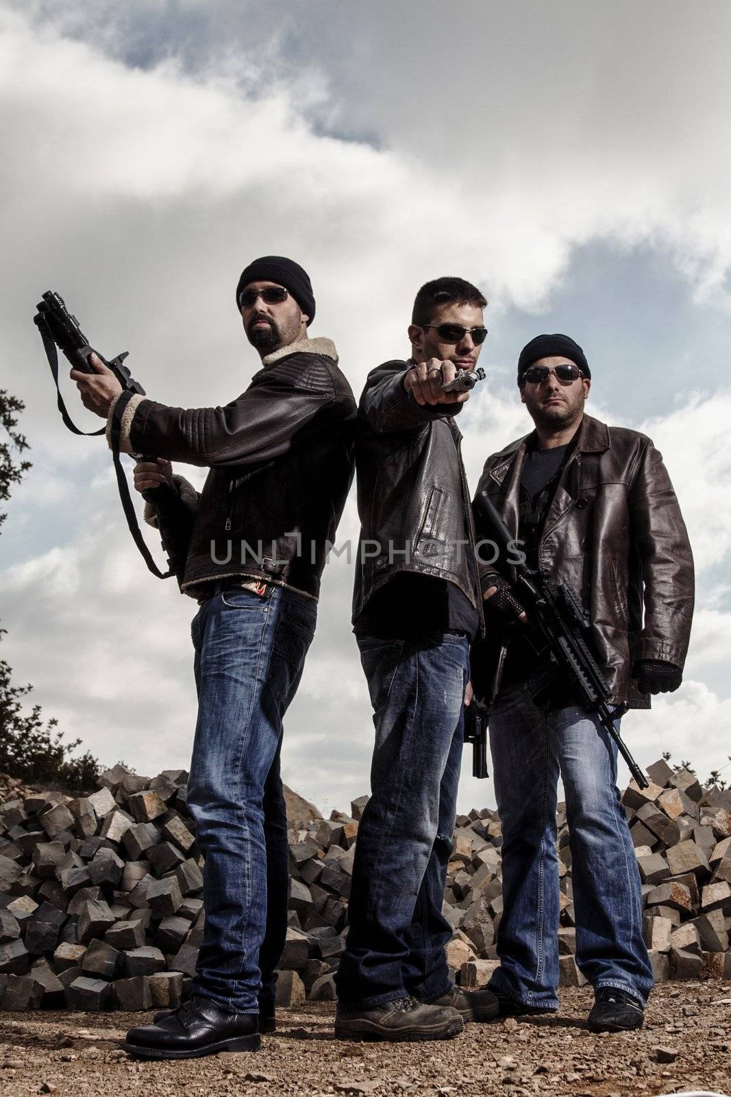 View of a group of gang members with guns.