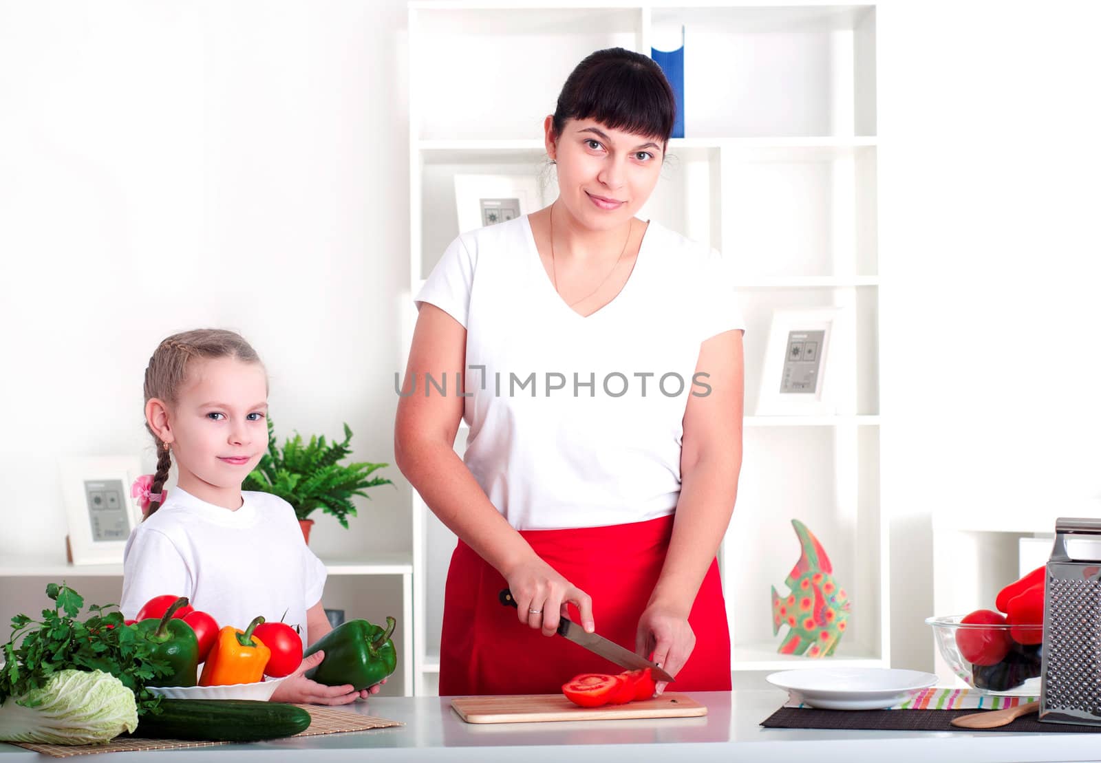 mom and daughter cooking together by adam121