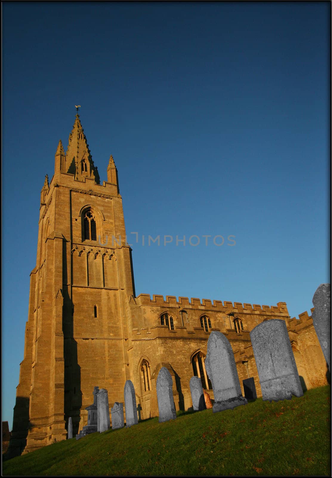 13th century church in Epingham against blue sky