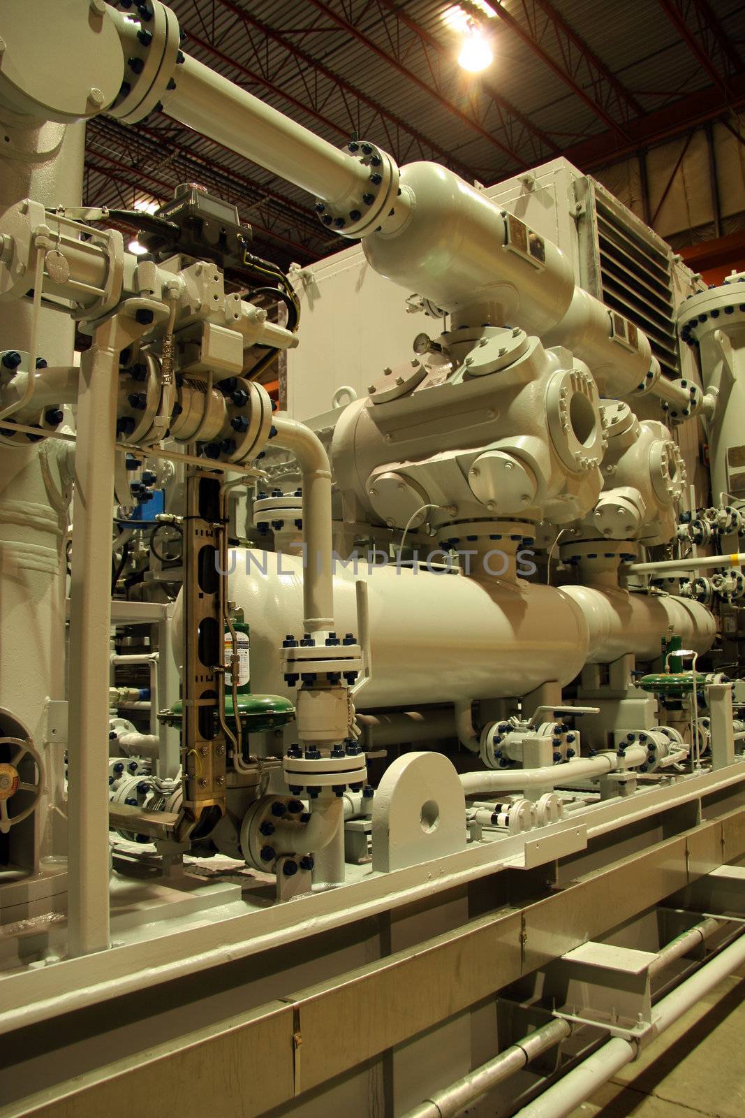 Technician working on a gas compressor