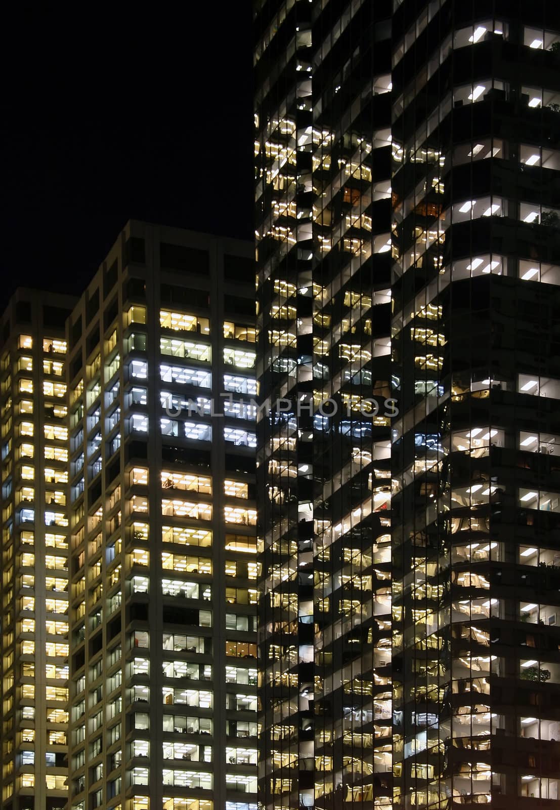 Modern city with high rises at night in Calgary, Canada