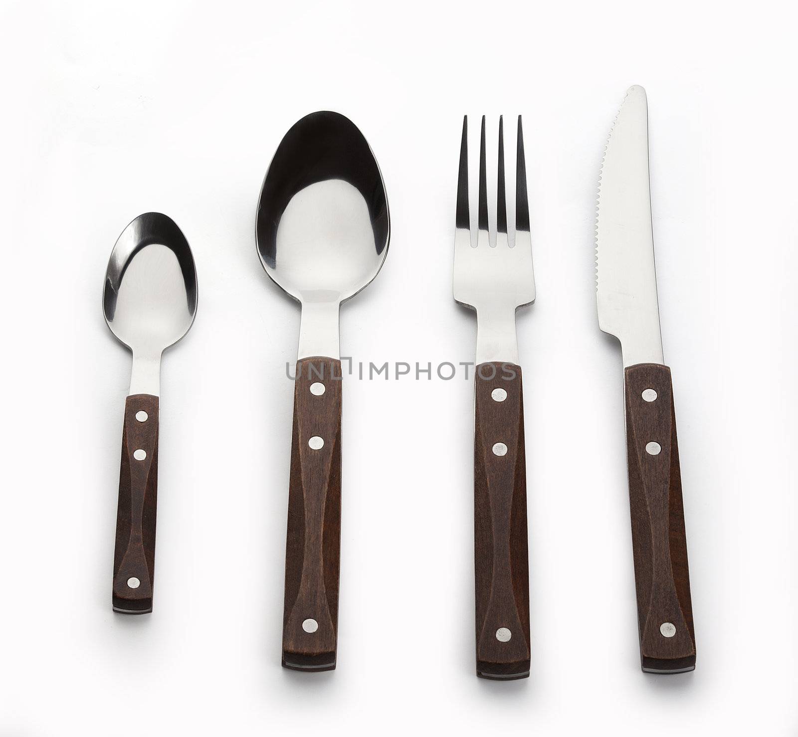 Set of metal tableware with wooden handle on the white background