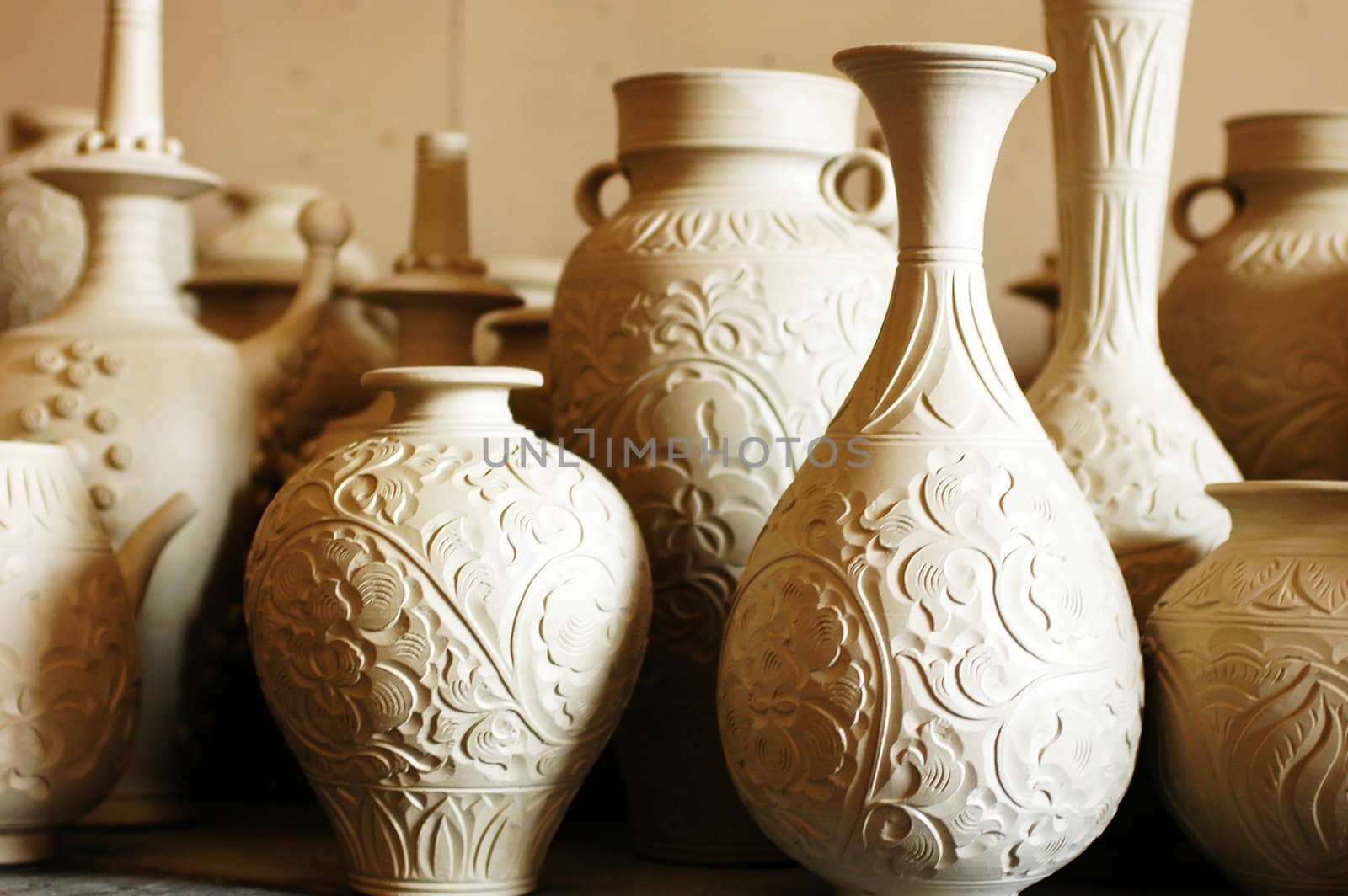 Raw vase and jug made of clay ready for being fired