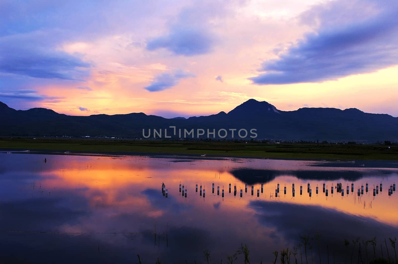Cloudscape and landscape at sunset