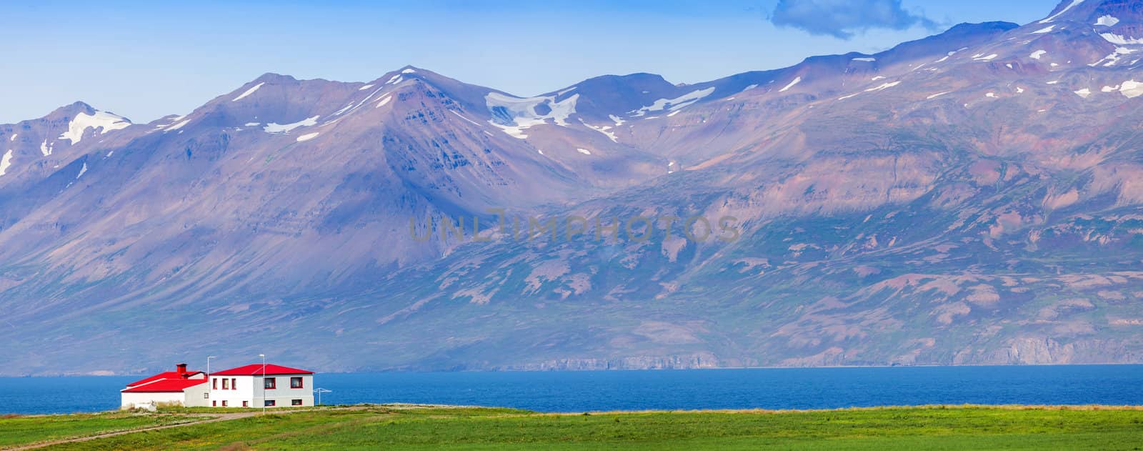 Landscape view with one beautiful cottage in Iceland. Panorama.