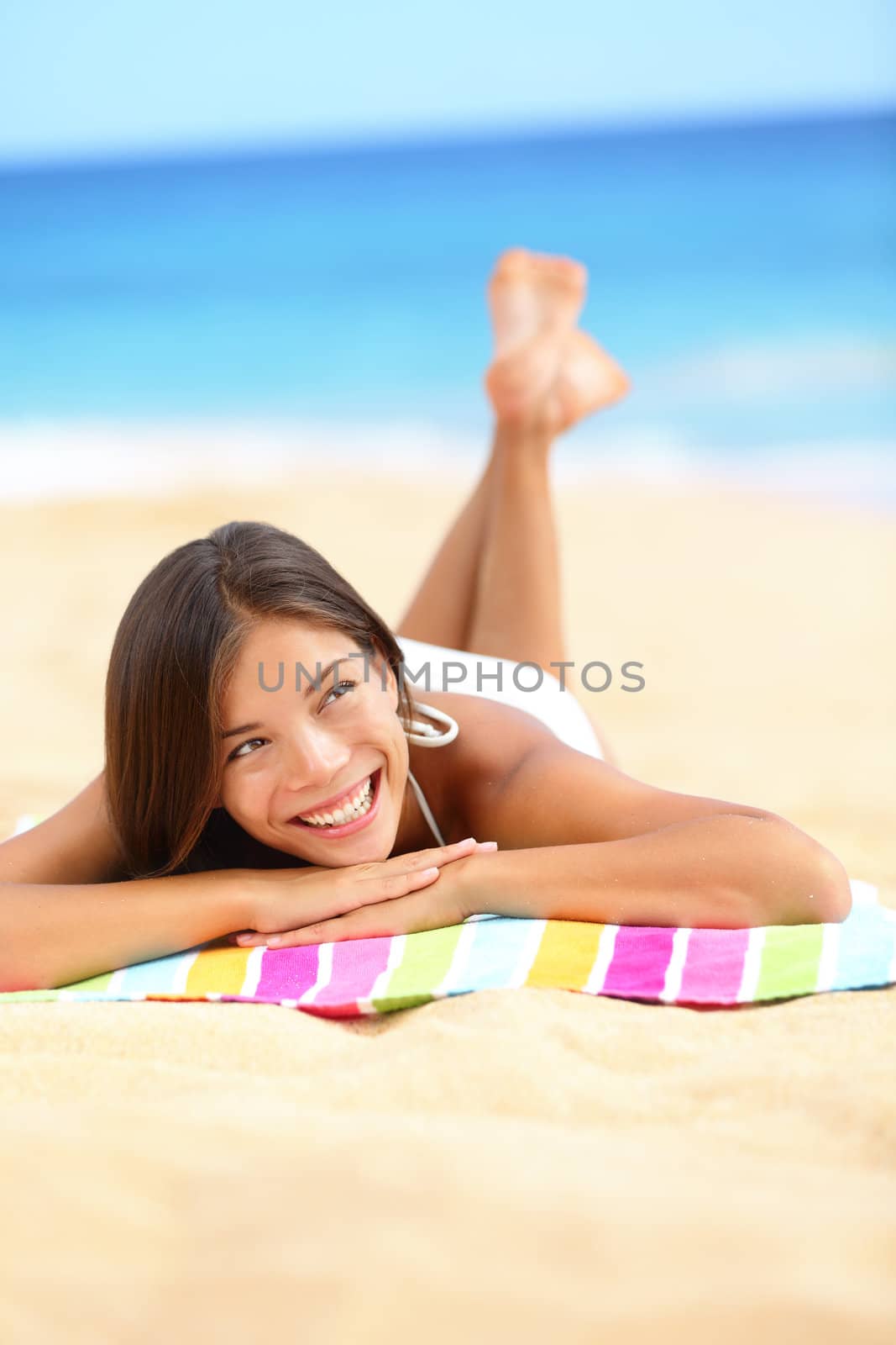 Vacation beach woman lying down relaxing looking by Maridav