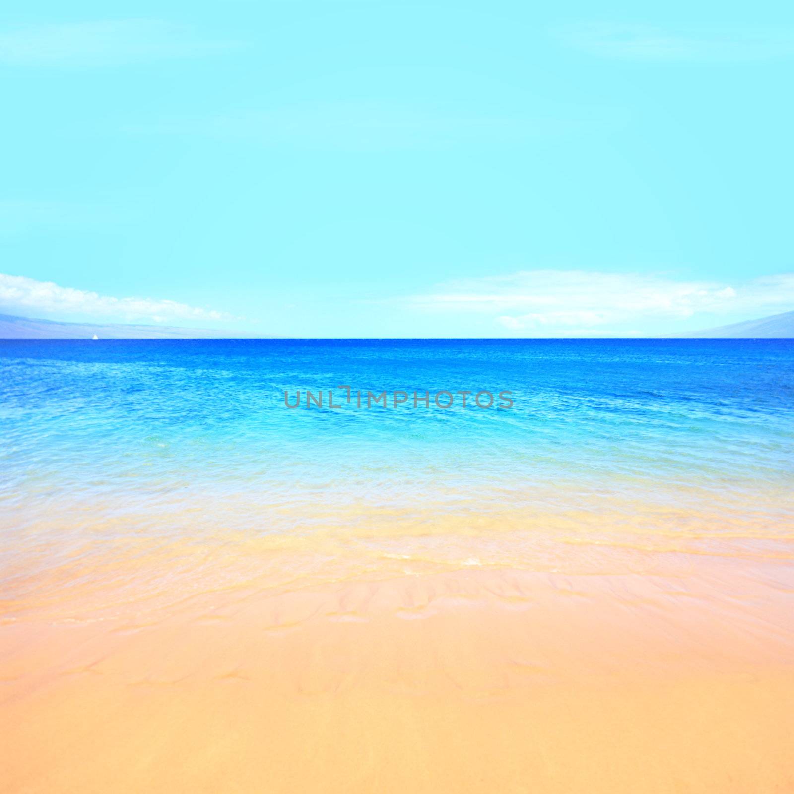 Beach ocean background texture. Blue water, sky, sand and beach. Travel, vacation and summer holidays getaway concept photo from Maui, Hawaii.