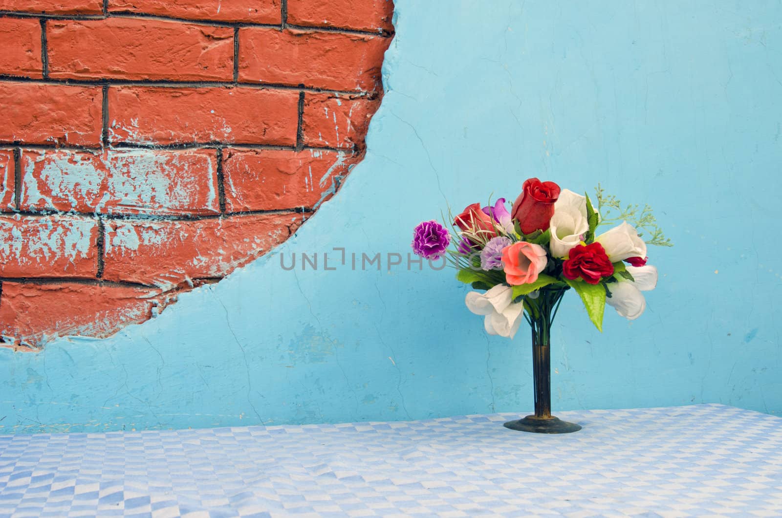 vase with flowers on table  by alis_photo