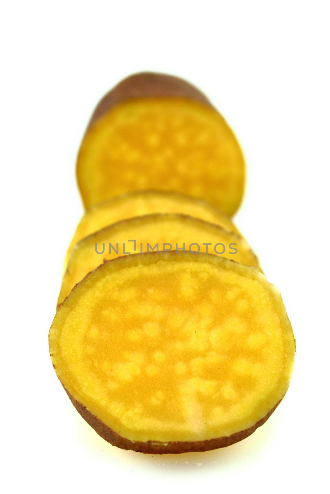 cutting sweet potatoes on white background
