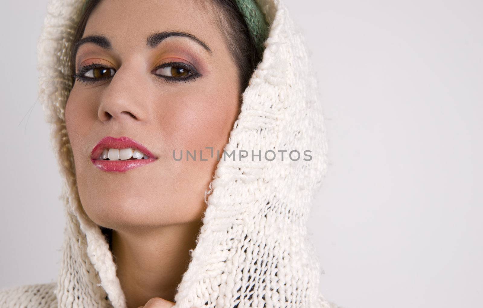 Attractive Woman Covering Her Head with Sweater by ChrisBoswell