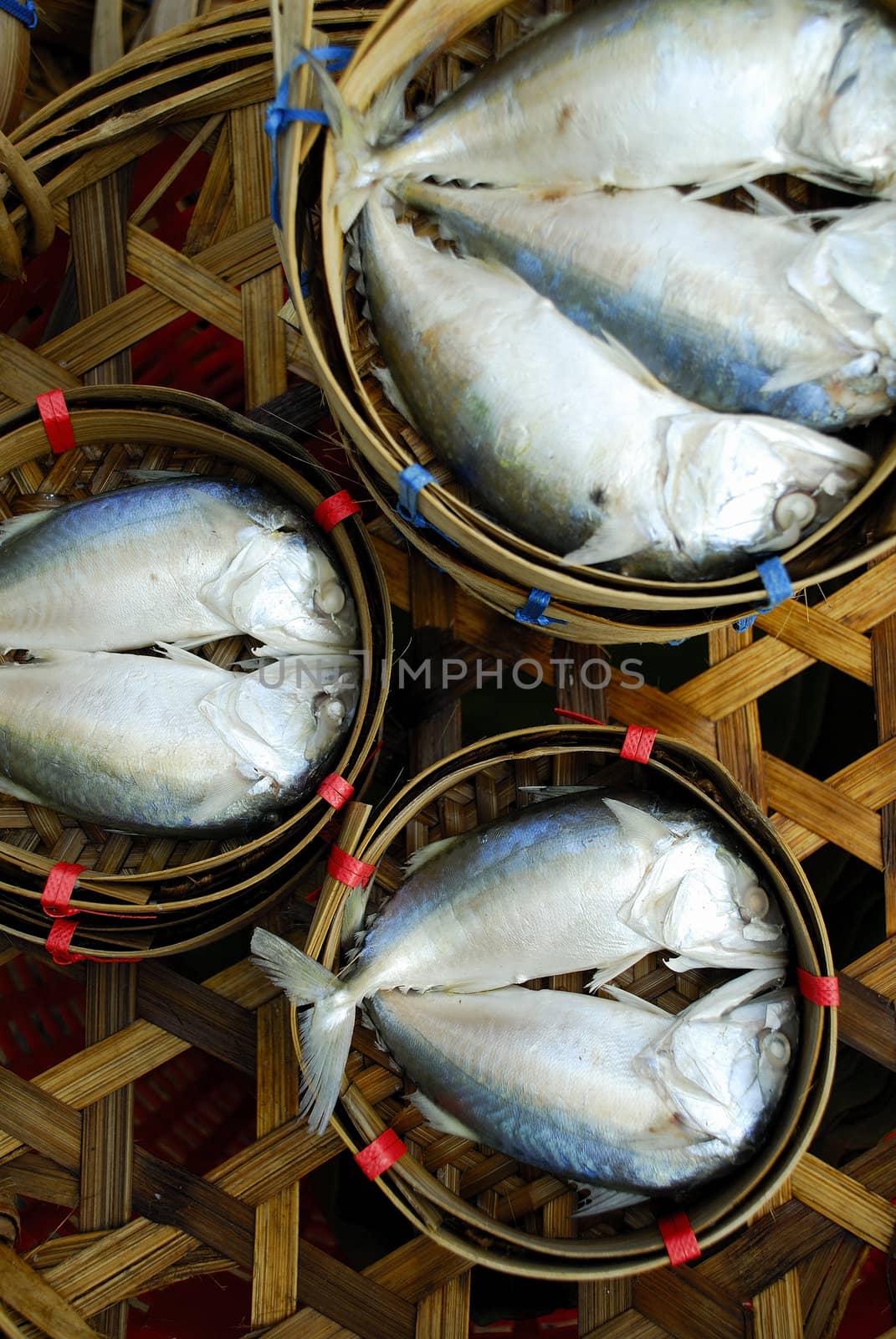 Mackerel fish in bamboo basket