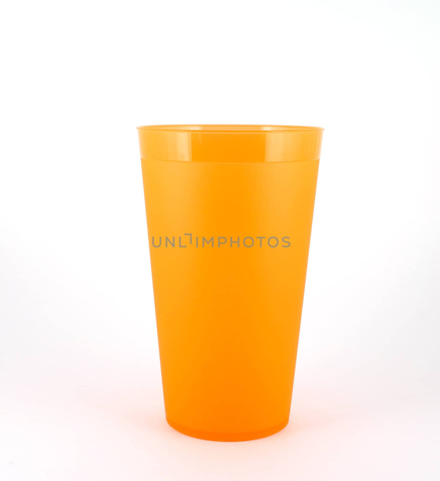 Orange plastic cup over white