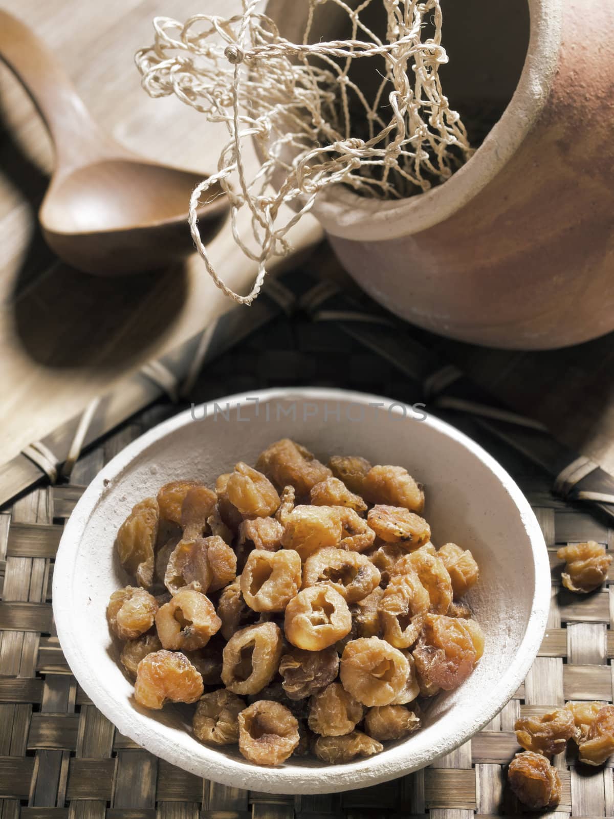 close up of a bowl of dried longans