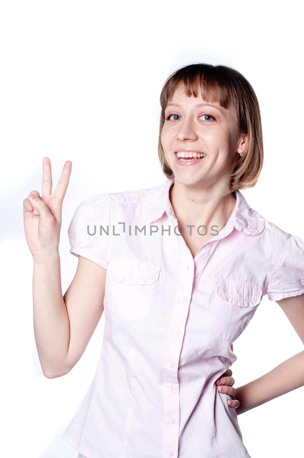 young girl shows gesture two fingers raised by Triphka