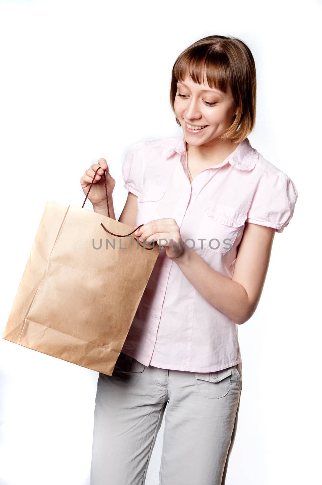 young girl looks into the bag by Triphka