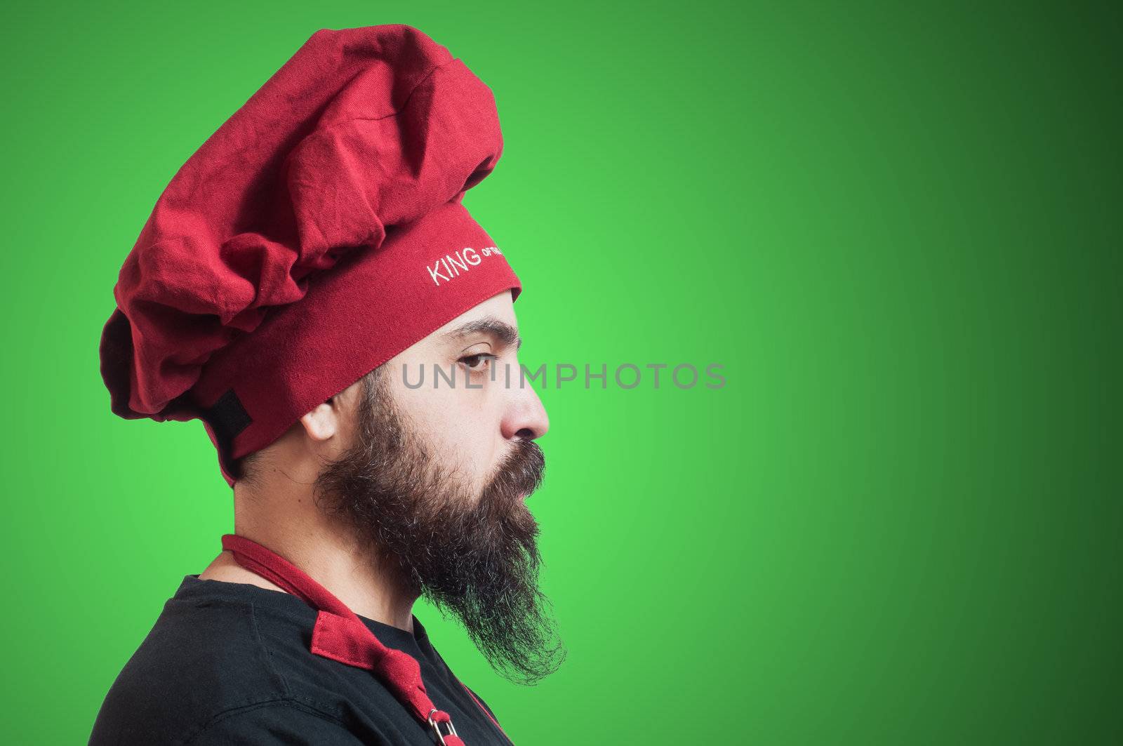 happy bearded chubby chef on green background