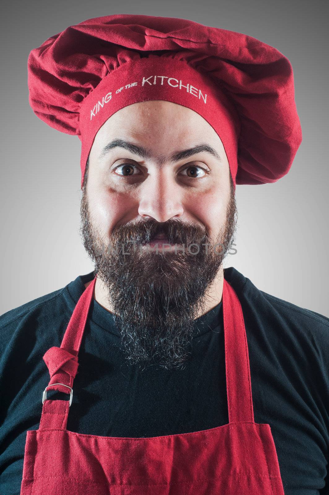 happy bearded chubby chef on gray background