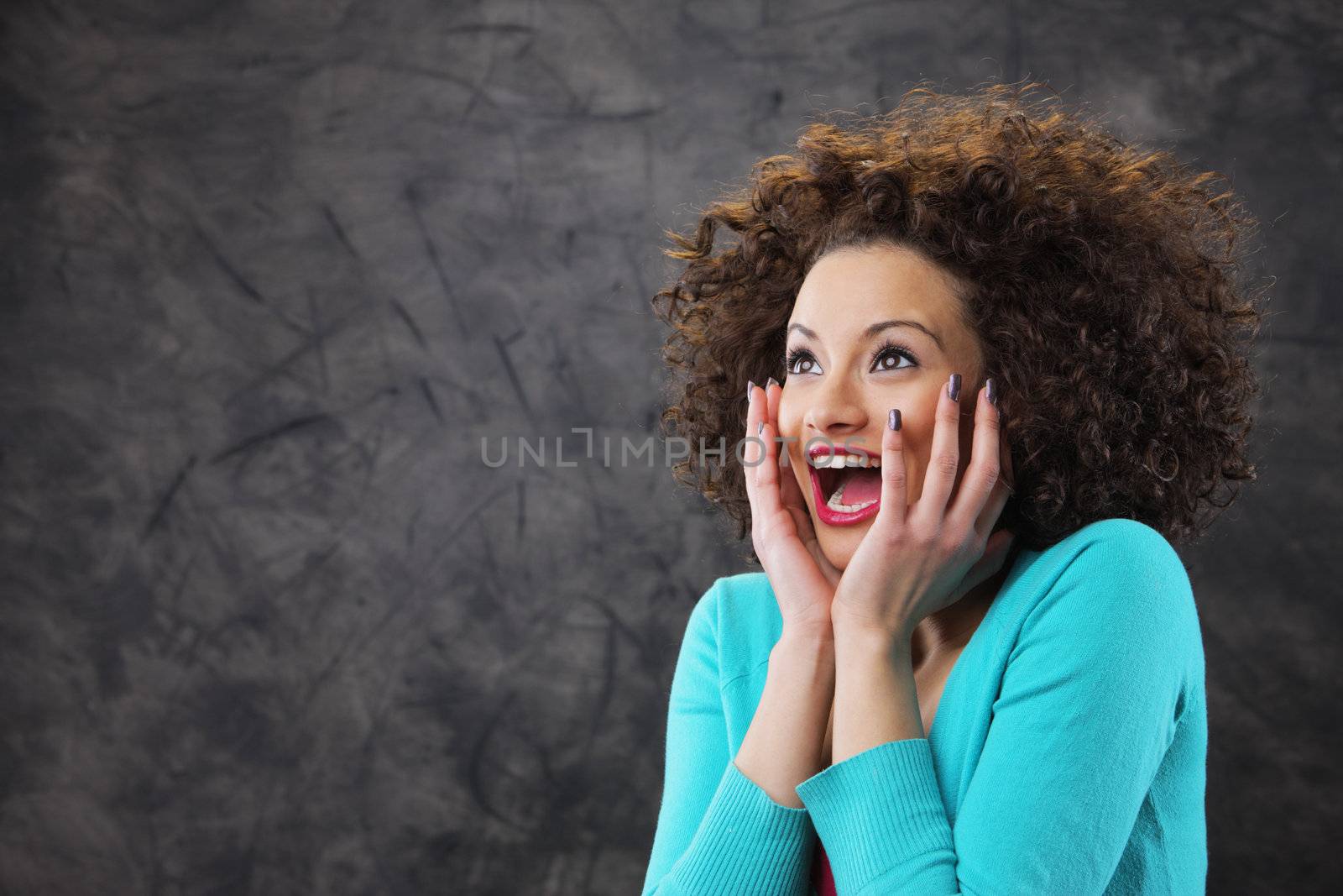woman looks surprised and happy