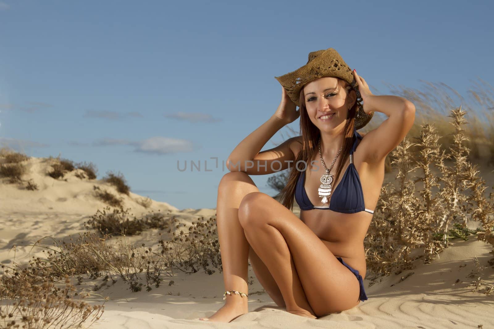 beautiful girl in the sand dunes of a beautiful beach by membio