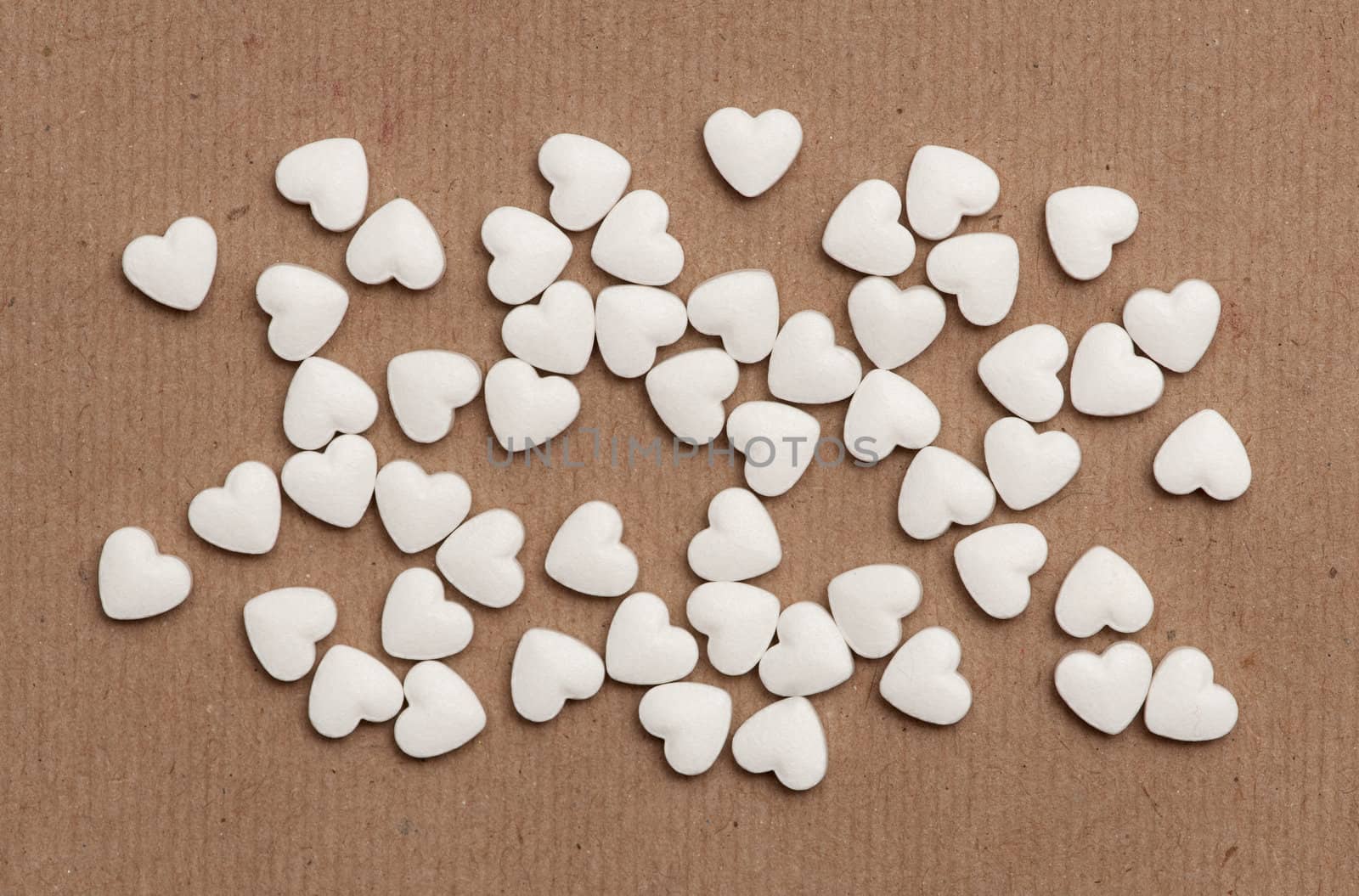 white pills in the form of heart
