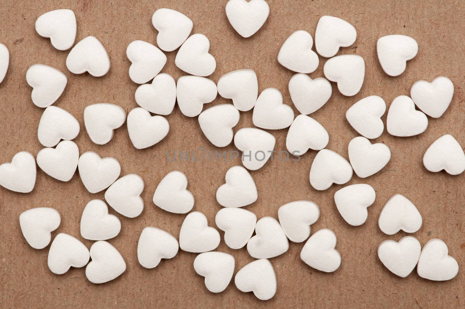 white pills in the form of heart by DNKSTUDIO