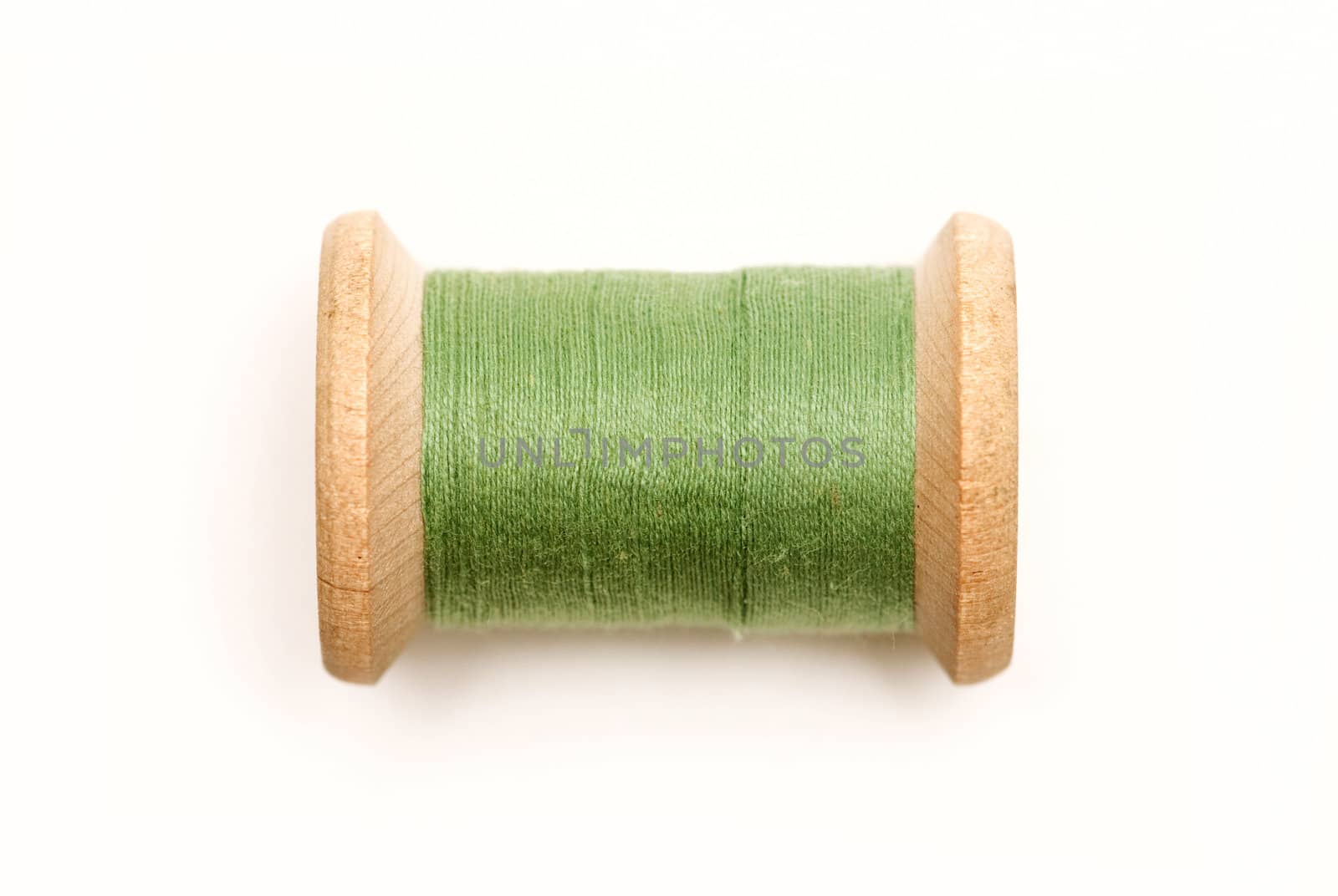 Thread bobbin on white background