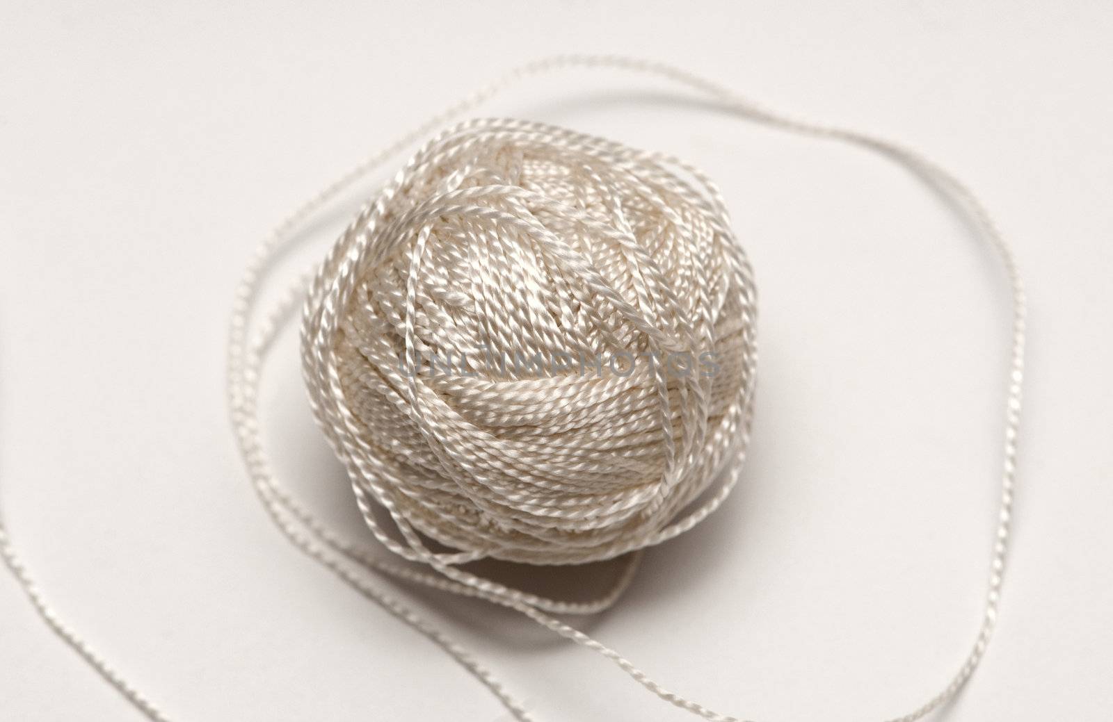 simple cord skein on white background by DNKSTUDIO