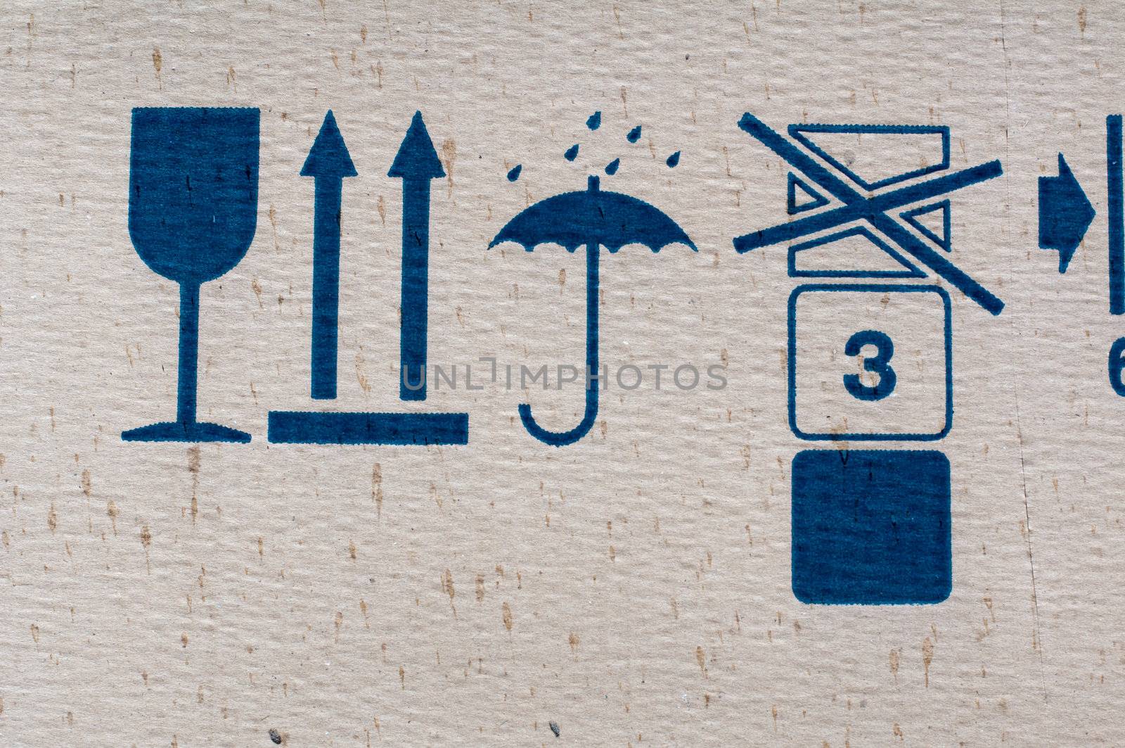 Packing symbols on old cardboard box by DNKSTUDIO