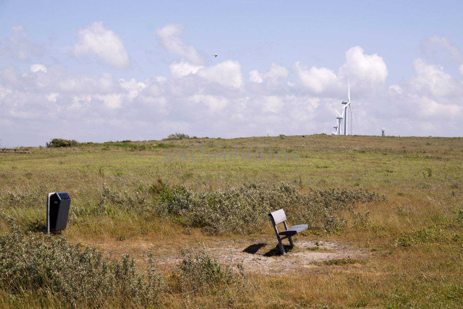 Lonely bench on the foot of a hill