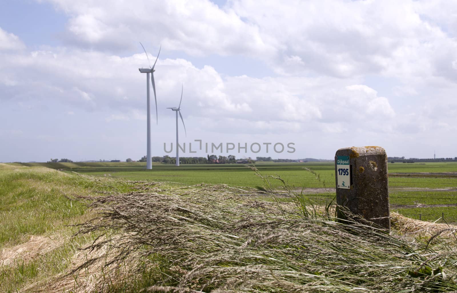 Mile stone at a dike in Holland