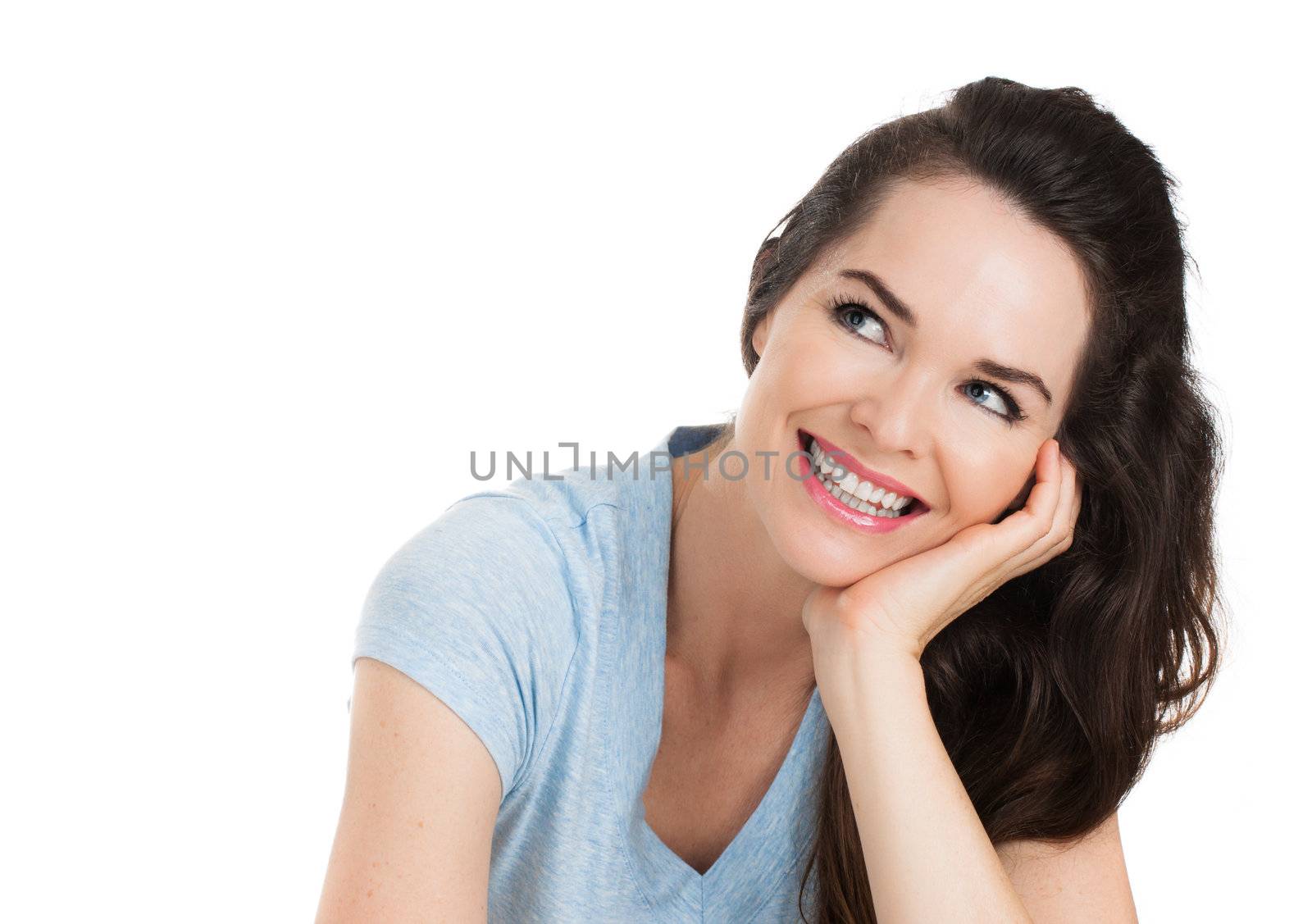 A close-up portrait of a beautiful happy smiling woman looking up at copyspace. Isolated on white.