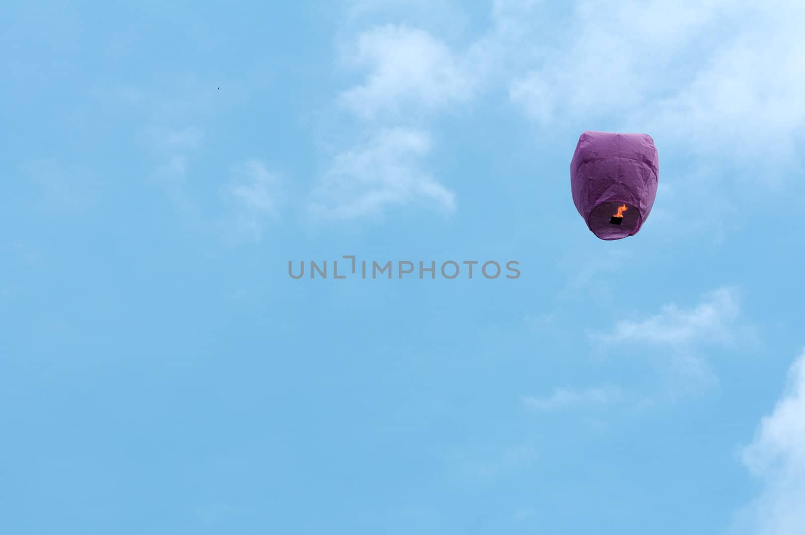 paper lantern with candle flying in the sky