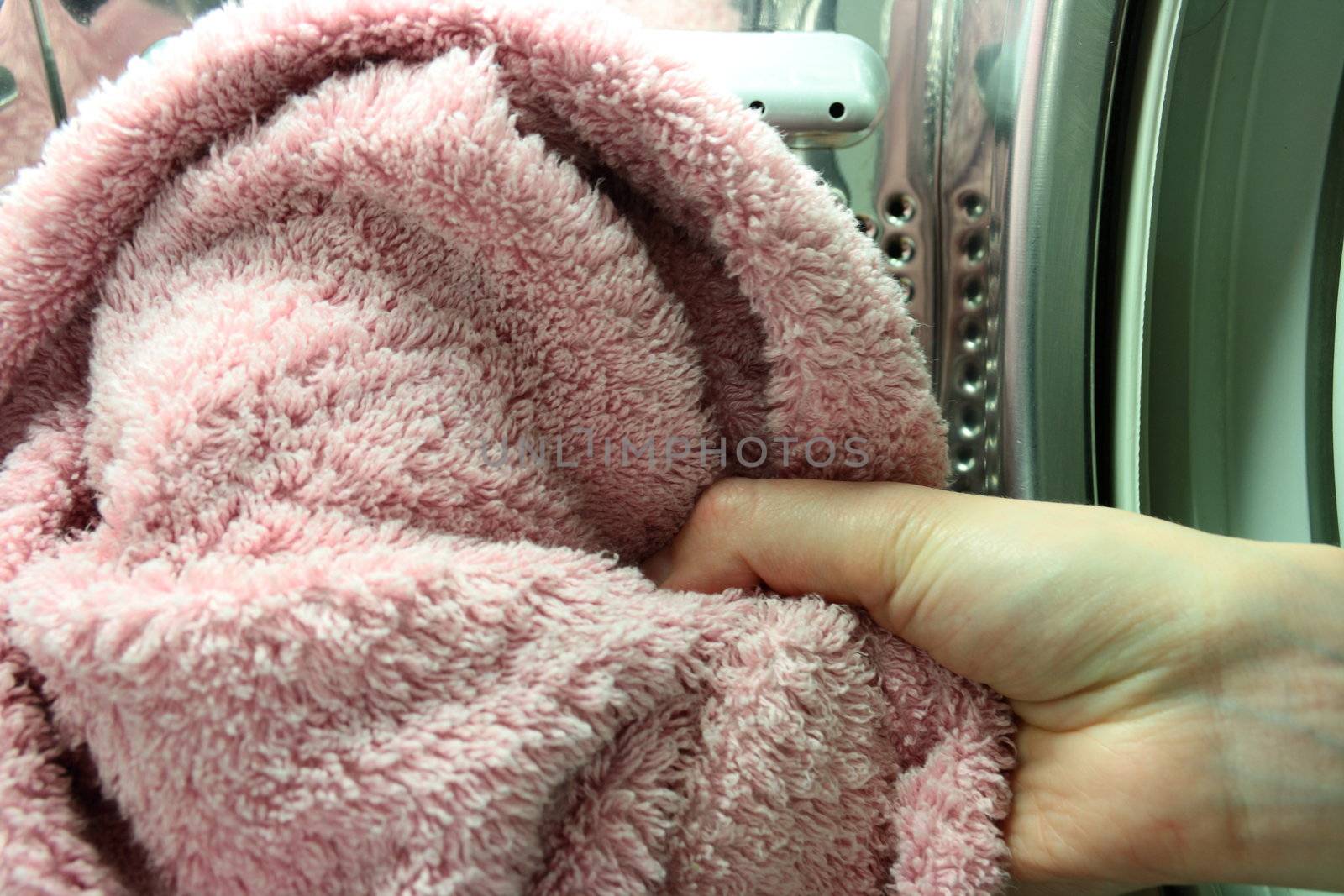 inside of washing machine hang holding towel