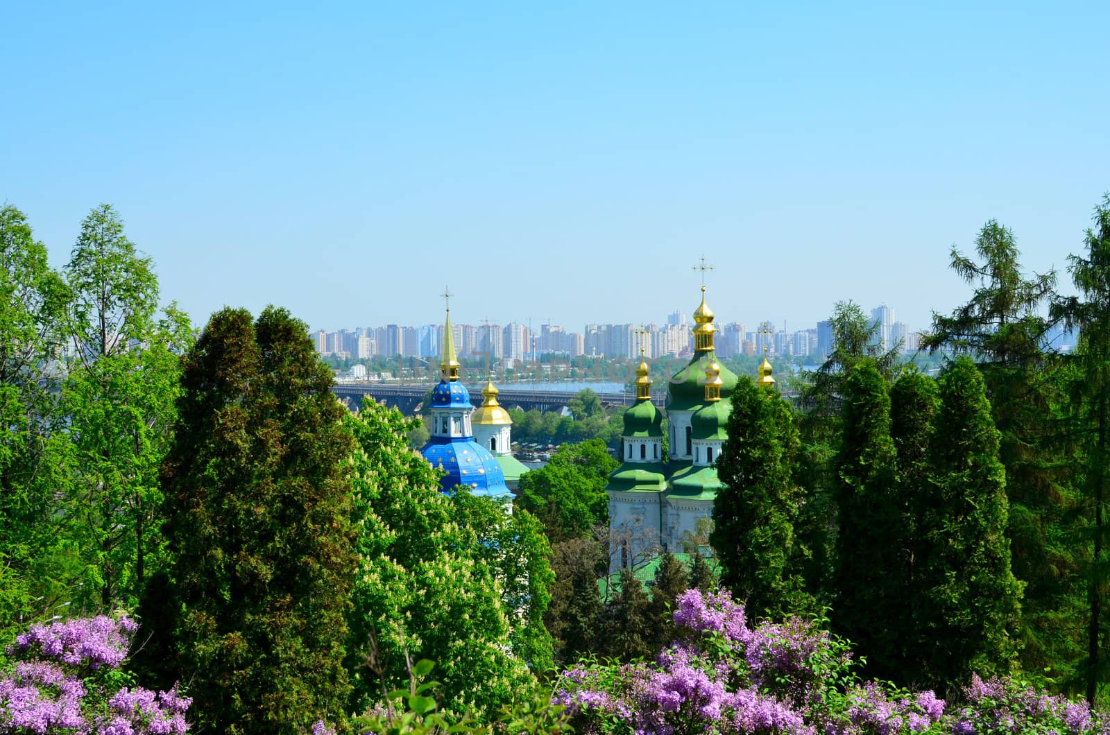 Vydubychi Monastery with blooming lilac by DNKSTUDIO