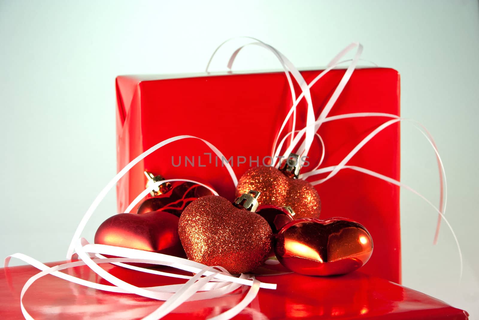 Red Hearts on wrapped gifts in red paper