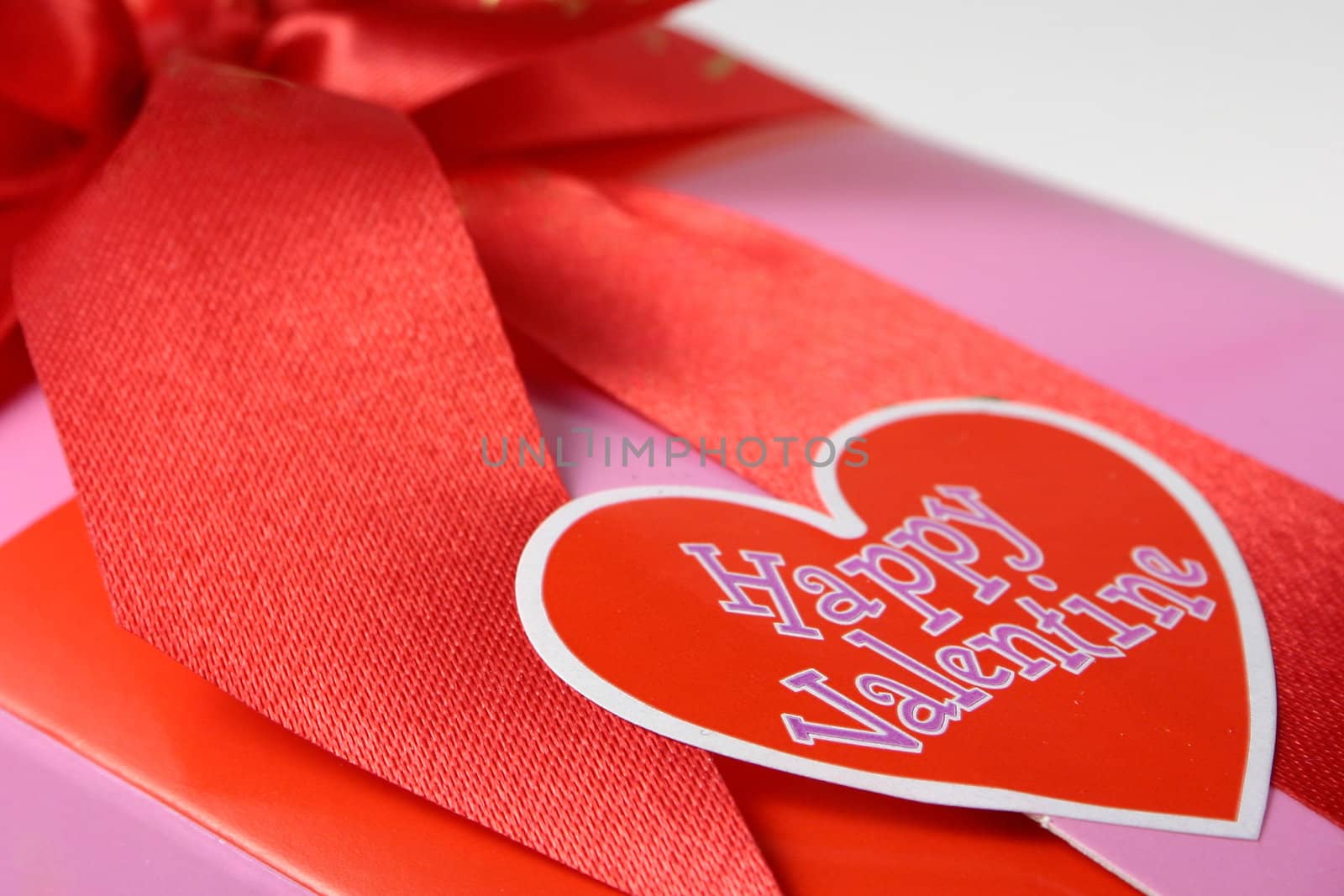 Red Valentine Heart on a pink wrapped gift