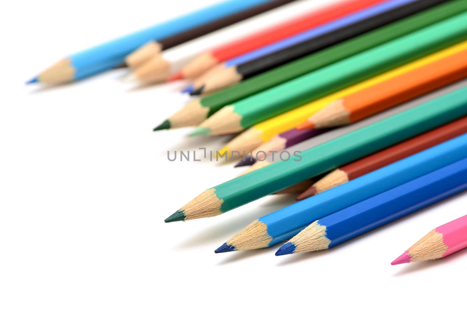 Colour pencils isolated on white background close up by DNKSTUDIO