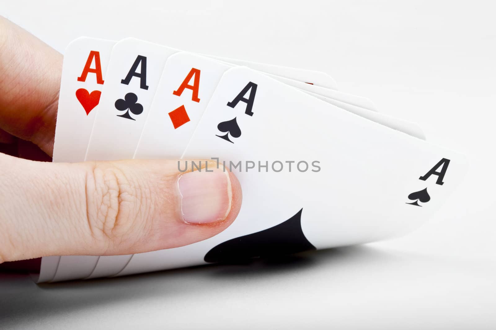 Hand of Four Aces over a white background.