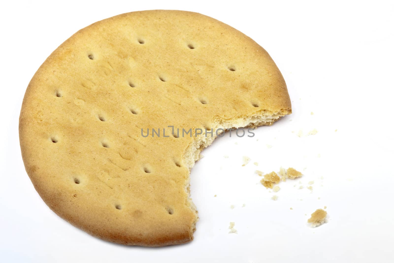 Half-eaten biscuit over a white background.