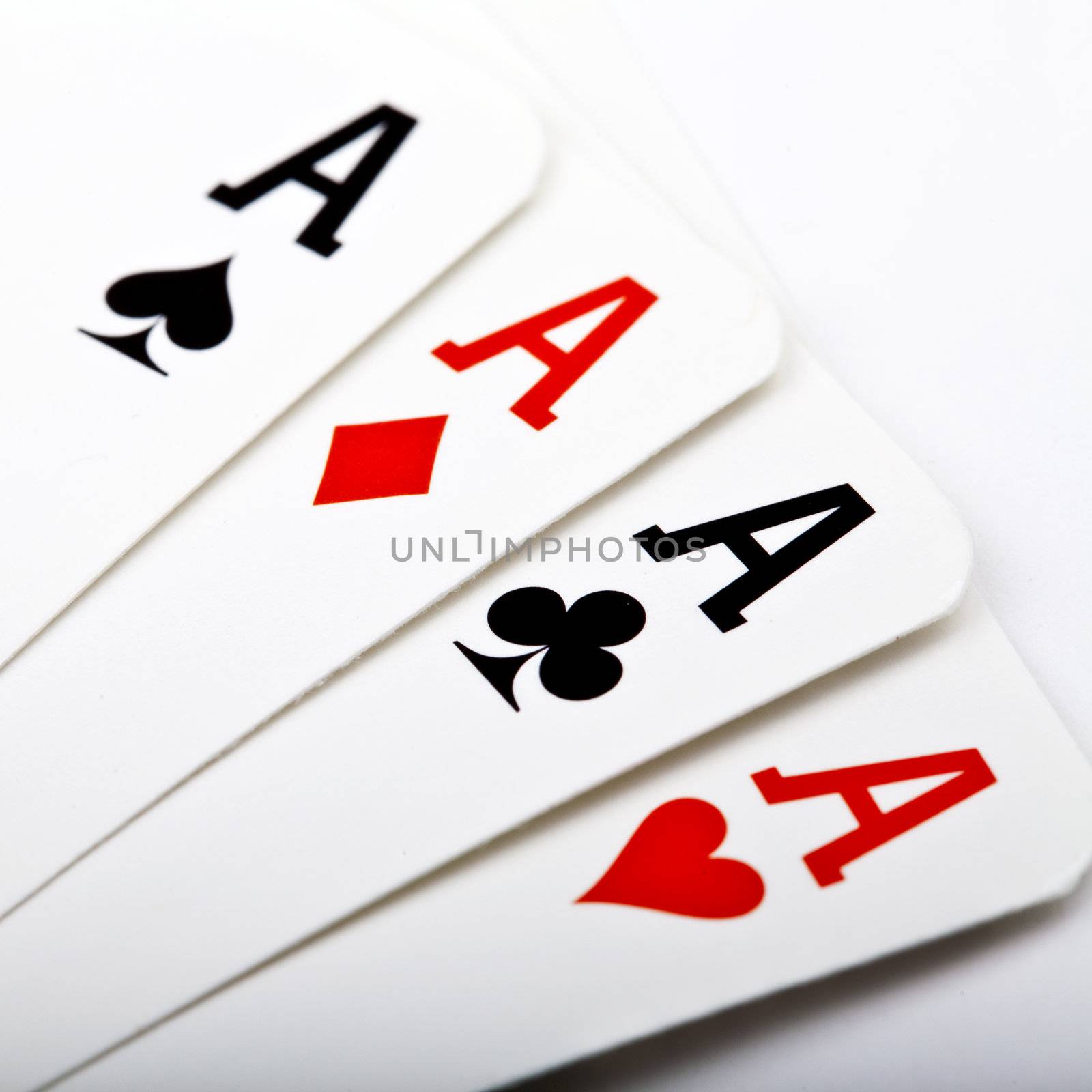Four Aces laid flat on a white background.