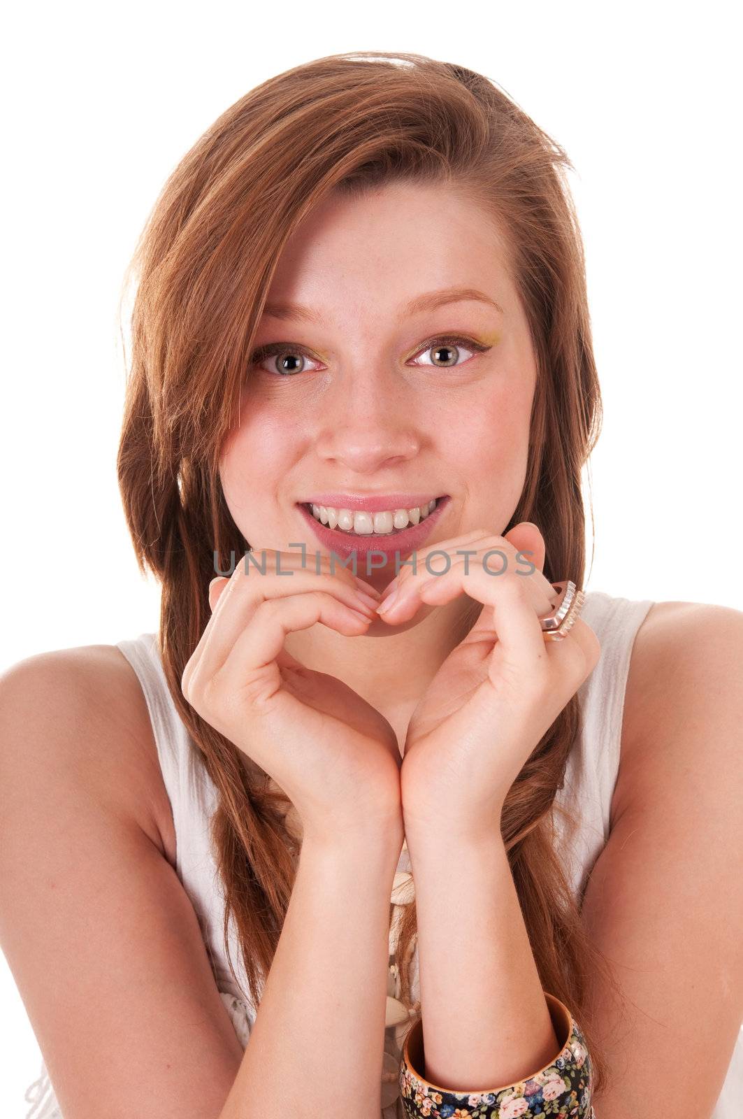 Teenager is showing heart by hands, isolated on white