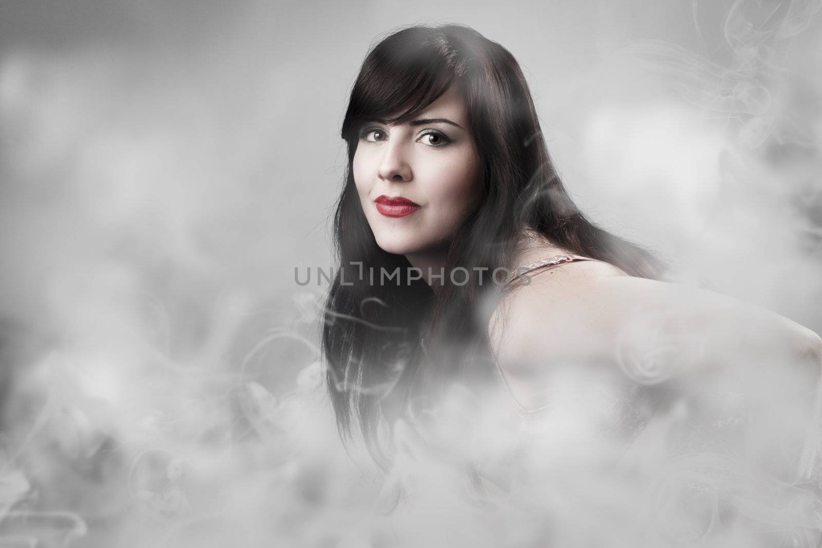 Sexy woman with lingerie over smoke backdrop