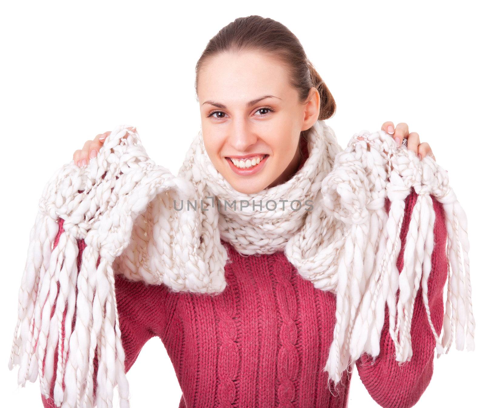 Beautiful young woman in red winter sweater and scarf on white background