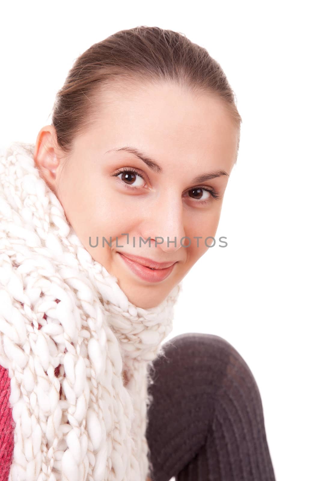 Beautiful young woman in winter scarf on white background