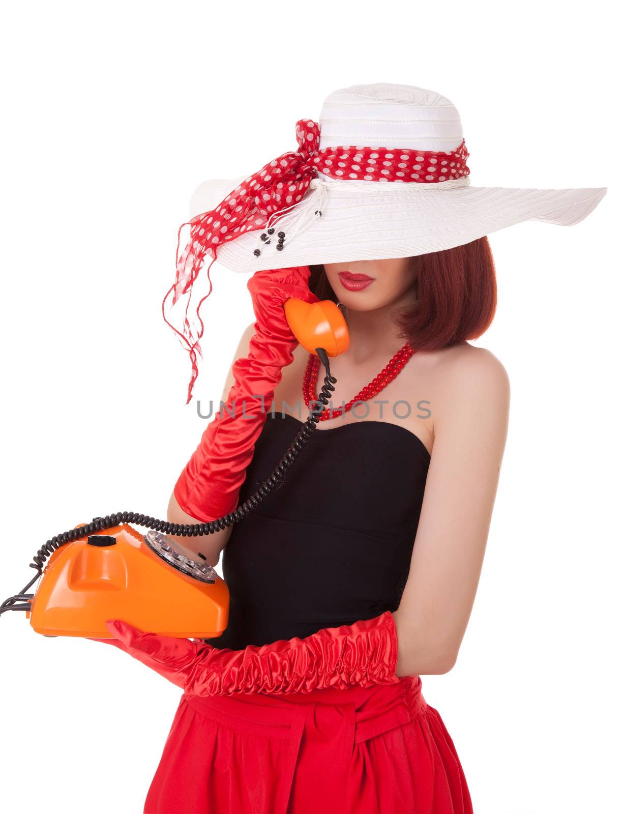 Fashion girl in retro style with vintage phone on white background